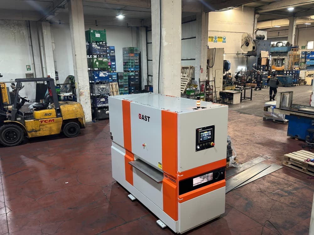 BAST 38-1050 sheet metal straightening machine with a touchscreen control panel in a production workshop