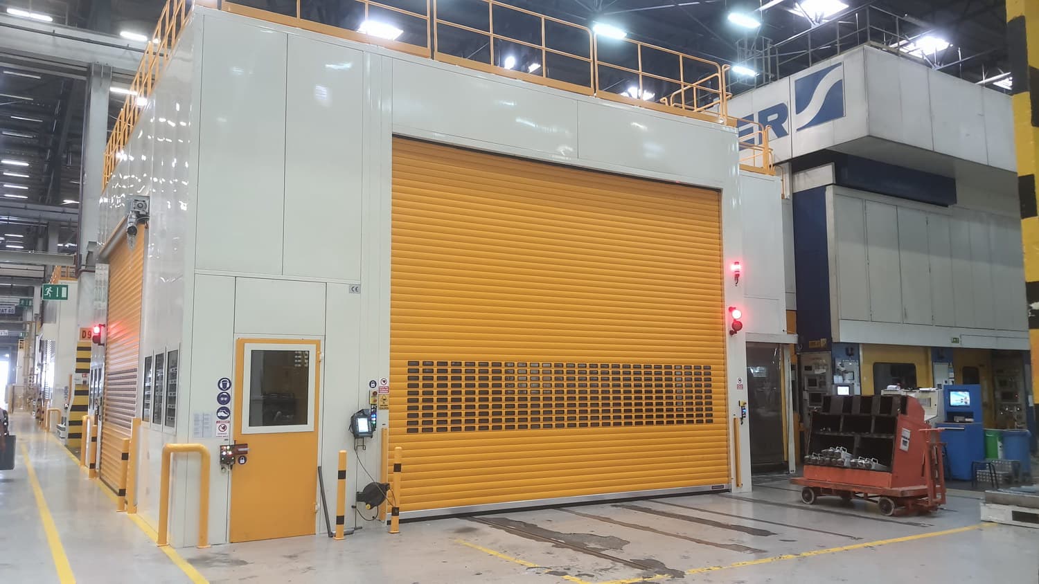 Industrial press guarding system with enclosed safety barriers and access doors