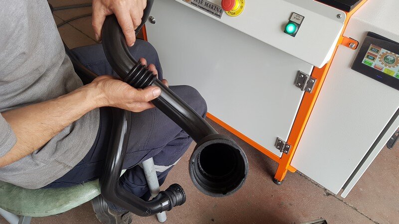 Why Are Mold and Temperature Control Critical in Automotive Plastic Processing Machines? 4 Inspection of a welded automotive plastic pipe on a pipe welding machine